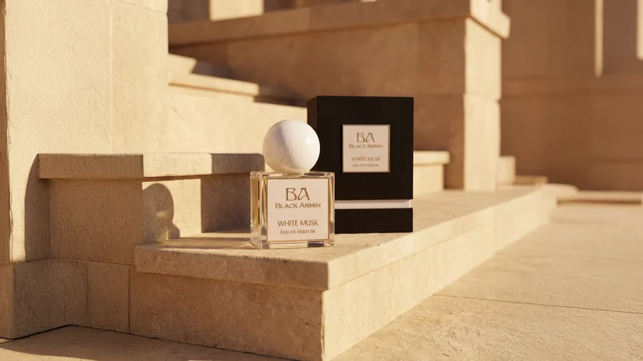 White Musk bottle with packaging on stone steps