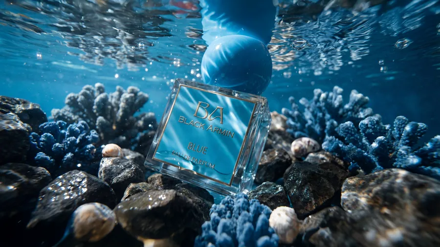 Blue bottle underwater among shells
